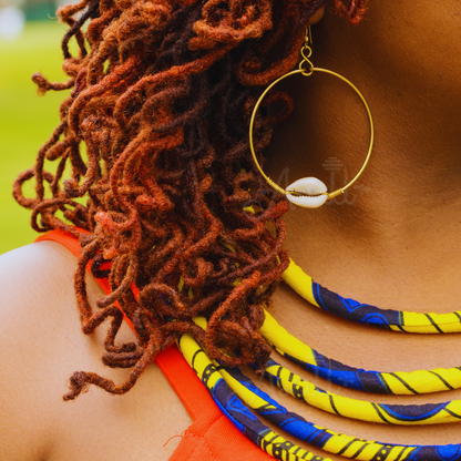 Shop Asali's Kenyan Brass Hoop Single Cowrie Shell Earrings