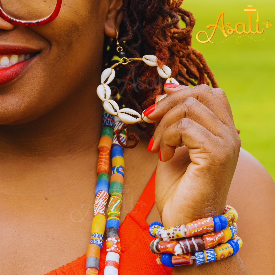 Shop Asali's Kenyan Brass Cowrie Shell Hoop Earrings